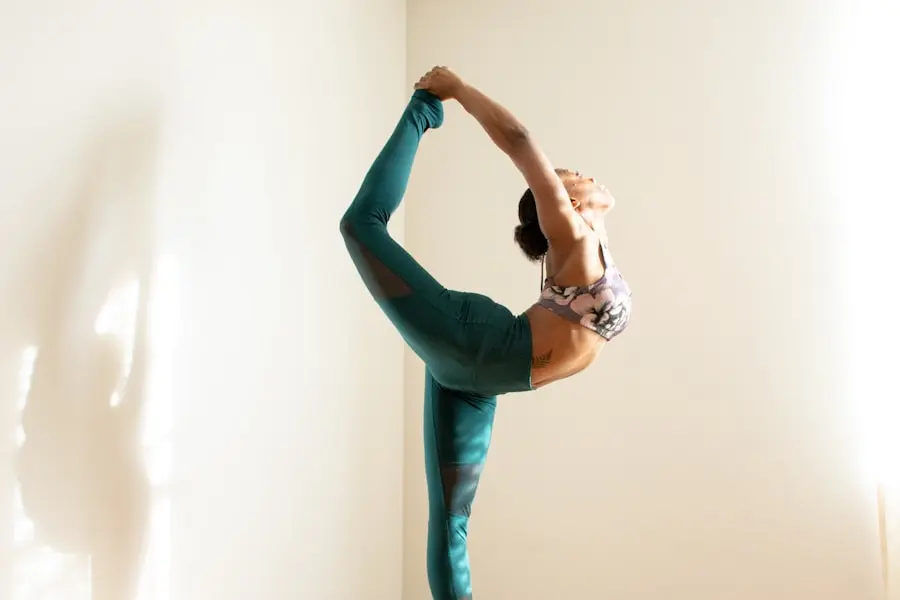 A person moving through a gentle standing pose in warm light, calm and unhurried